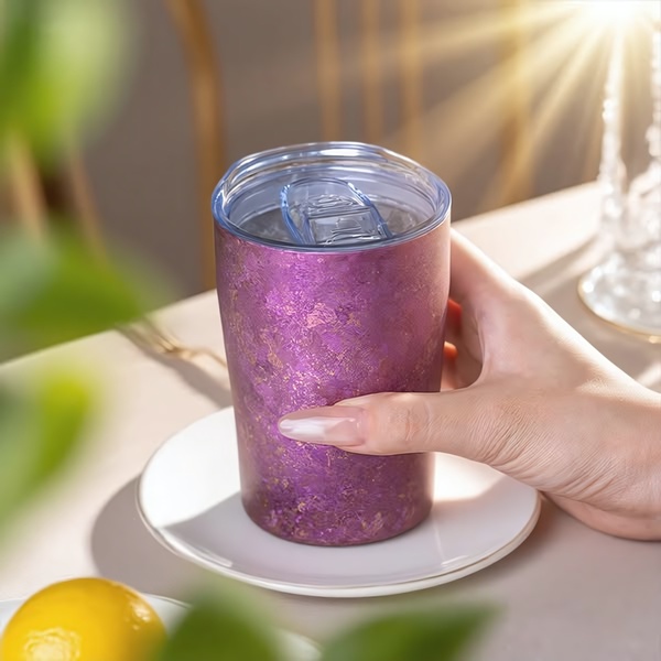 stainless steel tumbler, travel mug, insulated cup, coffee tumbler, reusable drink cup, product demo, lifestyle, calm, warm, purple, neutral